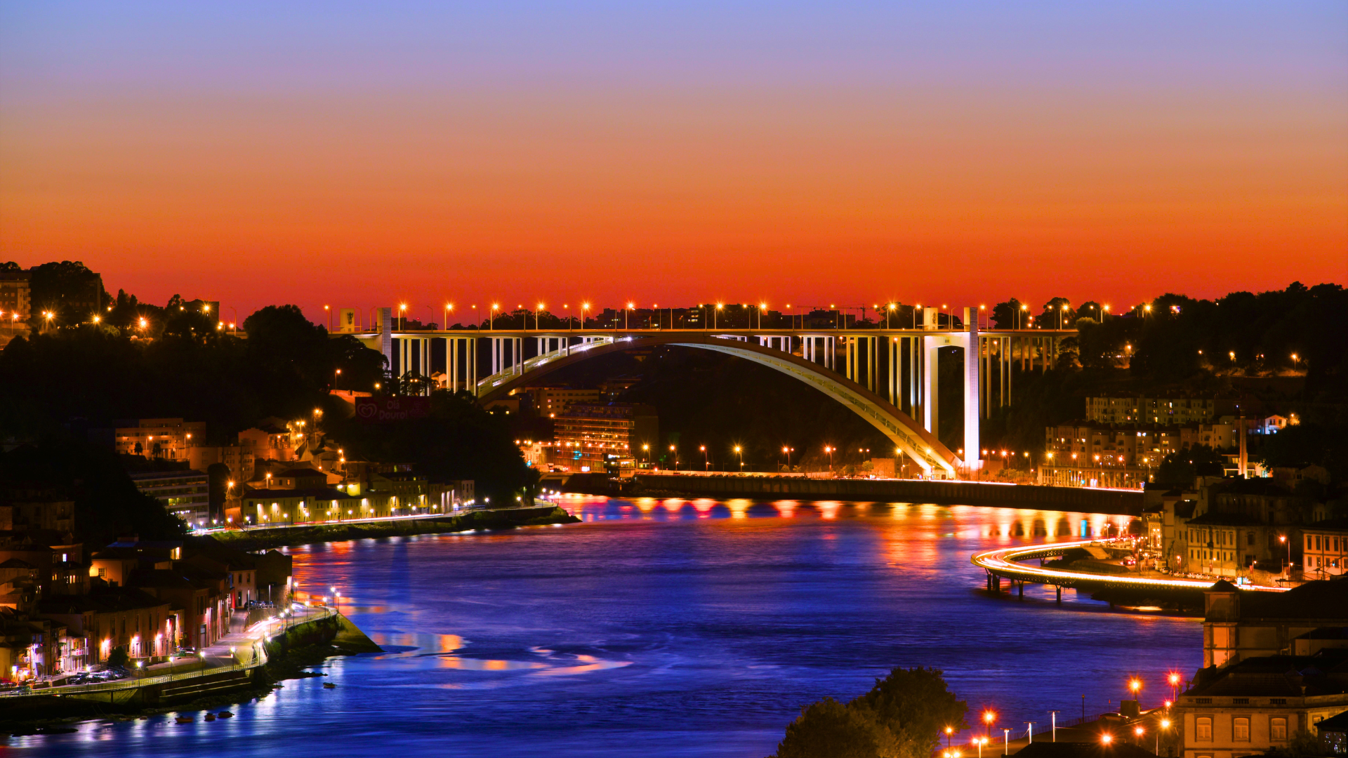 Arrábida Bridge at night in Porto