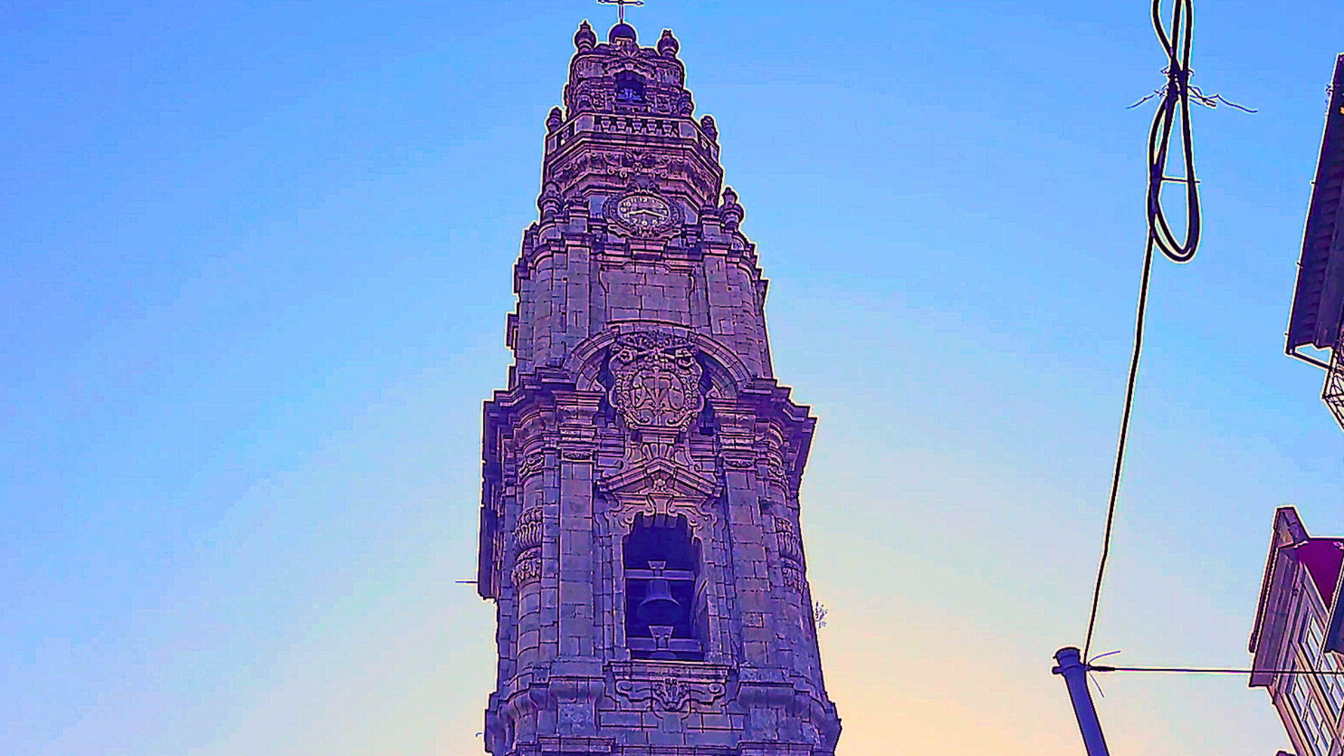 View from Clérigos Tower showing the historic clock and rooftops of Porto